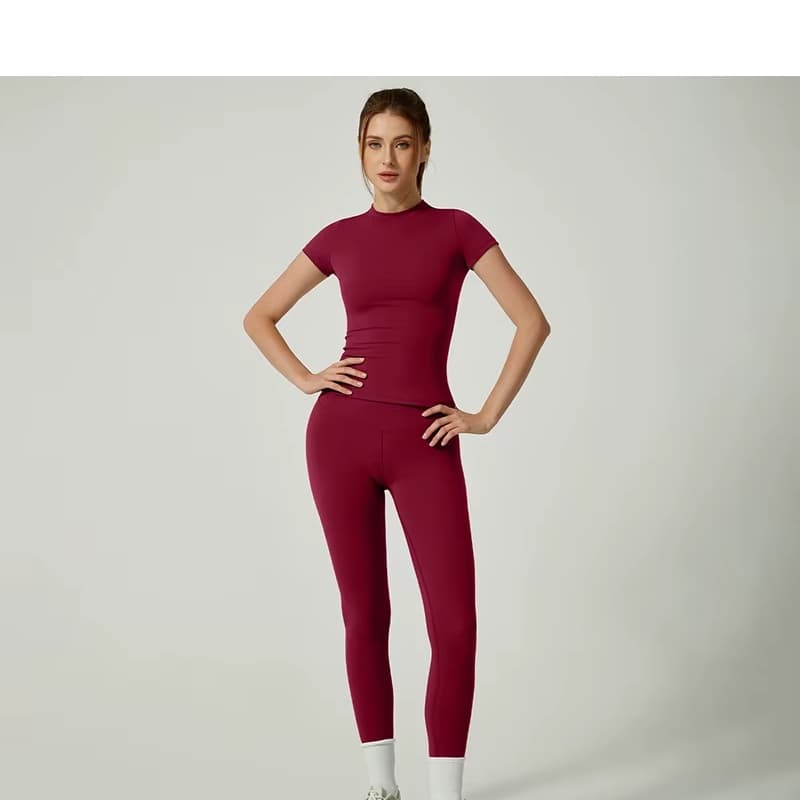 Second-Skin Active Set in burgundy — fitted tee and high-waist leggings on model